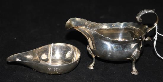 A George III silver cream jug, London 1768, maker BM and a Georgian silver pap boat initialled SH (marks rubbed)